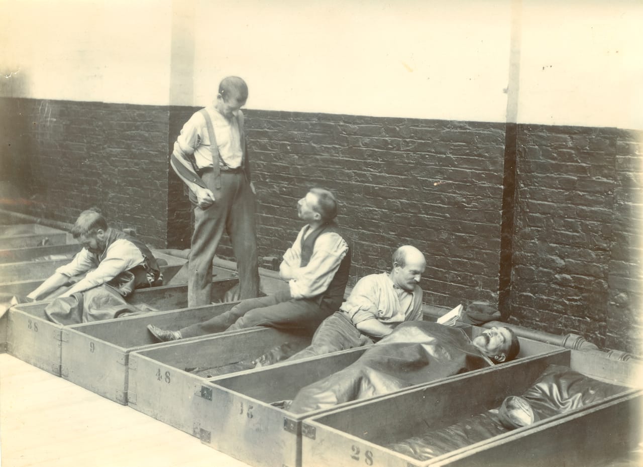 Men in coffin beds in a Salvation Army Shelter c1900 © The Salvation Army Heritage Centre