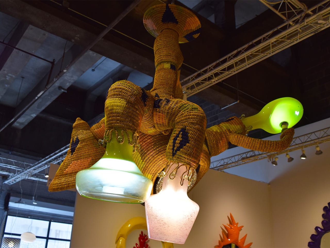 A hanging light fixture by Misha Kahn in the Friedman Benda booth at Collective Design