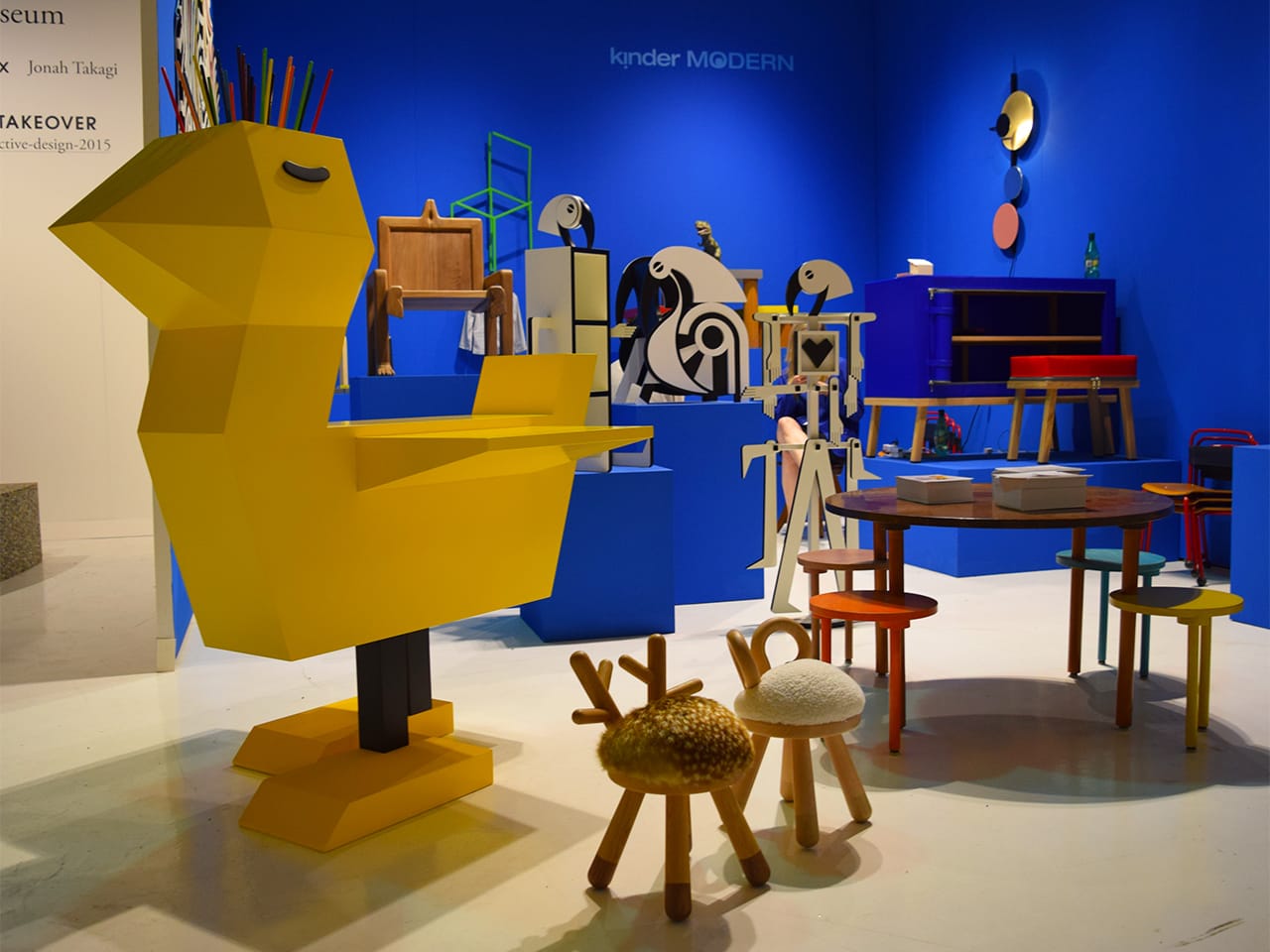 The kinder MODERN booth at Collective Design, including Guillaumit's "Chicken Desk" at left