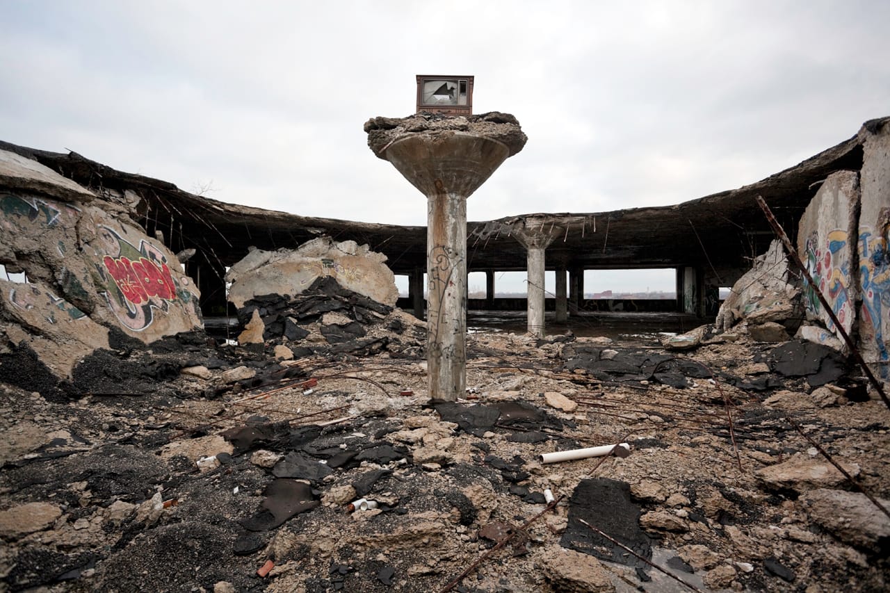From Hocking's 'Garden of the Gods' series, wherein he improbably mounted the dumped shells of television sets on the columns formerly supporting the roof of the Packard Auto Plant