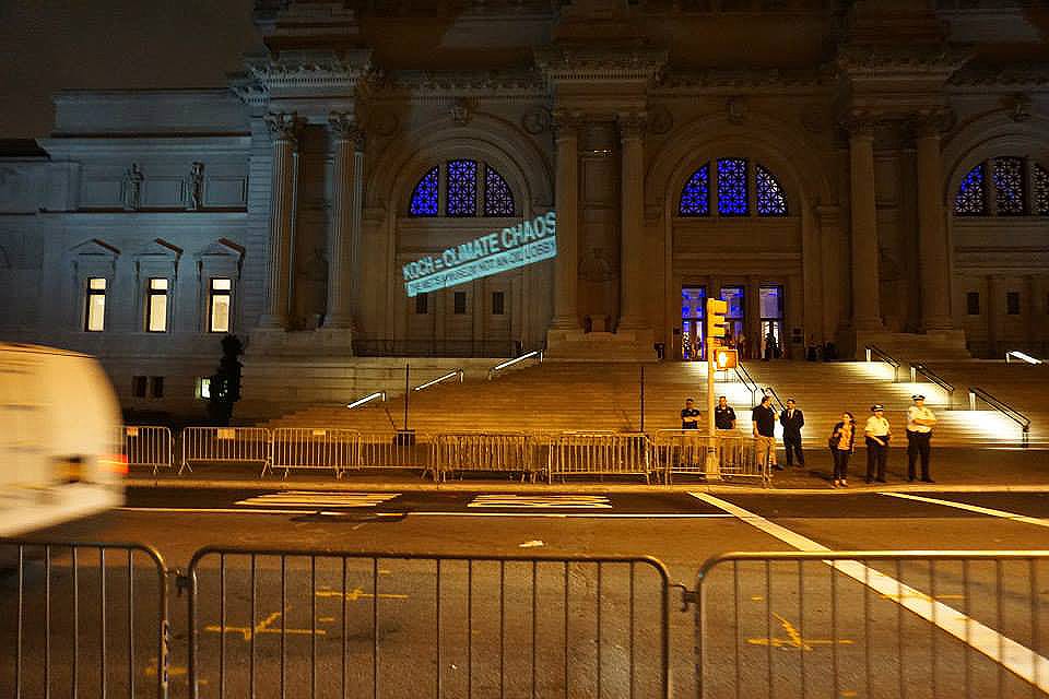 The Illuminator projected “Koch = Climate Chaos” on the facade of the Metropolitan Museum of Art on September 9, 2014. (image via Occupy Museums)