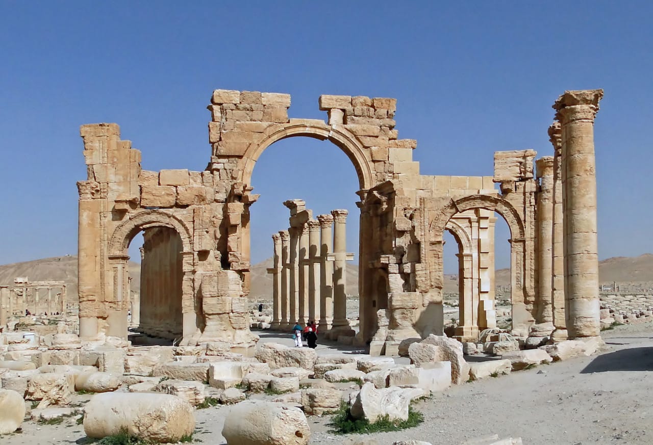 The monumental arch at Palmyra (photo by Bernard Gagnon/Wikimedia Commons)