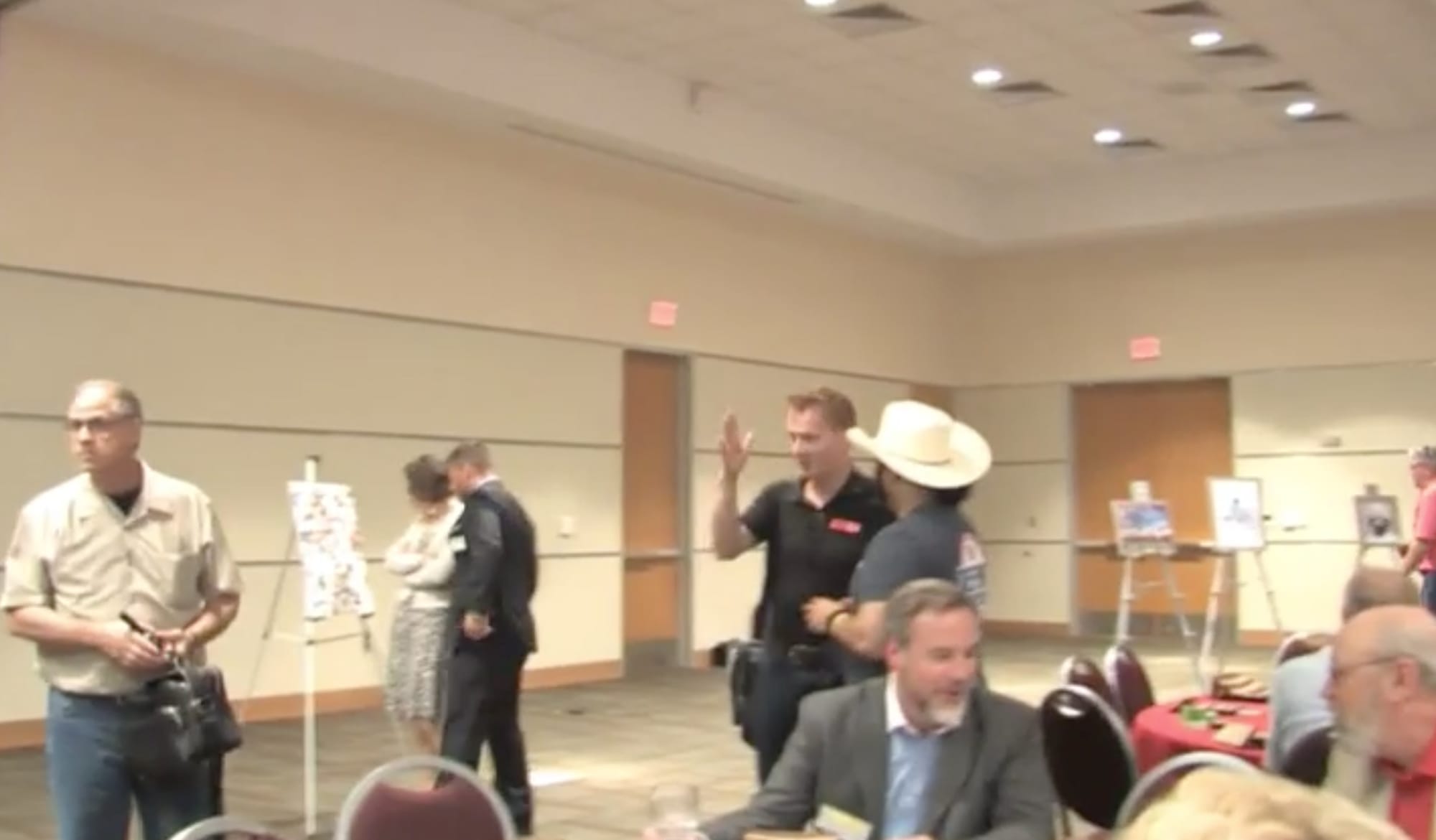 A view of the convention center hall with "Draw Muhammad" submissions on tripods. (via The United West YouTube channel)