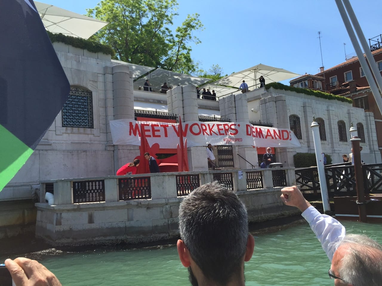 Peggy Guggenheim Collection staff removing protesters' banners and signs