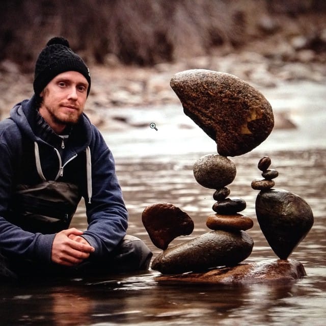 Michael Grab with some of his stone stacks (photo by GravityGlue/Instagram)