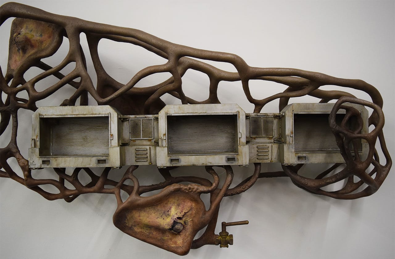 Detail of Dora Budor, "One Million Years of Feeling Nothing" (2015), screen-used miniature rooftop from 'The Fifth Element' (1997), steel armature, epoxy clay, infected silicone prosthetics, acrylic polymer with pigment suspension, sfx and weathering paint, and assorted metal hardware