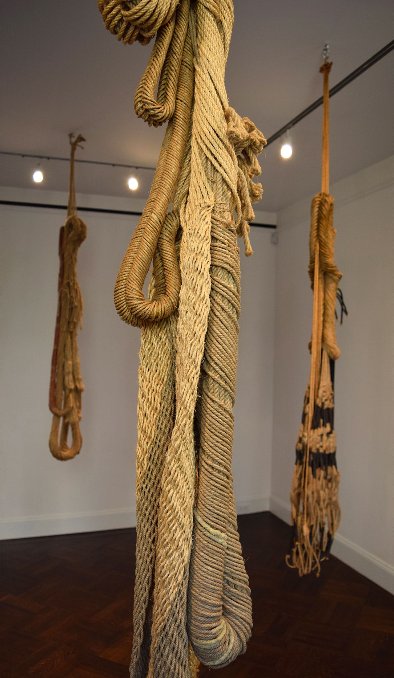 Installation view with Françoise Grossen's "Aglaia (pink touch)" (1991, left), "Thalia (all natural)" (1991, center), and "Euphrosyne" (1991, right)