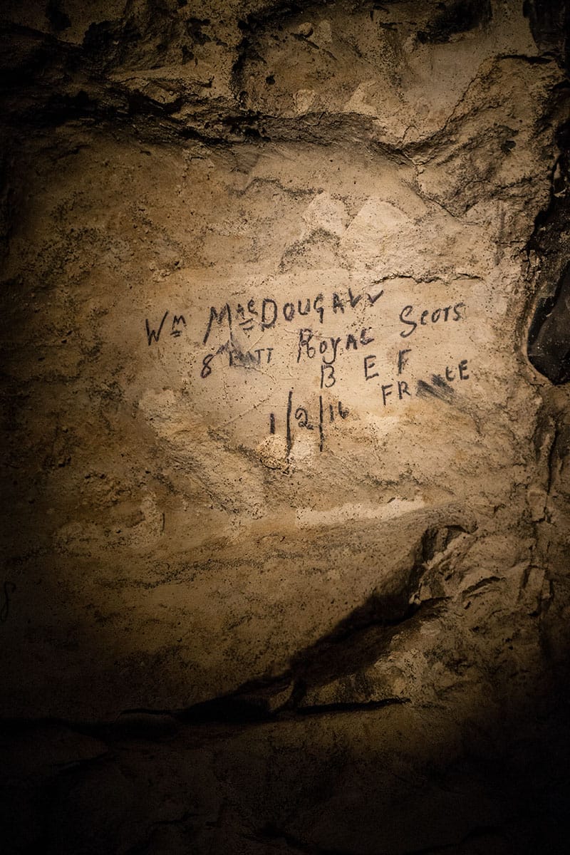WWI soldiers inscriptions in the subterranean city at Naours  Bocage Hallue. Terms of Use: These photos are for one-time use, limited to professional media outlets and blogs, in connection with an accompanying story about Jeffrey Gusky, his work and WW1-related discoveries. Stories appearing during the license period may be archived online by the media outlet or blog who published the story. This image is a low resolution version of the original. Higher resolution images are available by special arrangement with the artist. This image may not be modified and may not be used commercially except with a commercial license. This image is not available under any Creative Commons license. Copyright (c) 2015 Jeffrey Gusky. All Rights Reserved. Jeffrey Gusky, c/o attorney at P.O. Box 2526, Addison, TX 75001-2526. photos@jeffgusky.com.