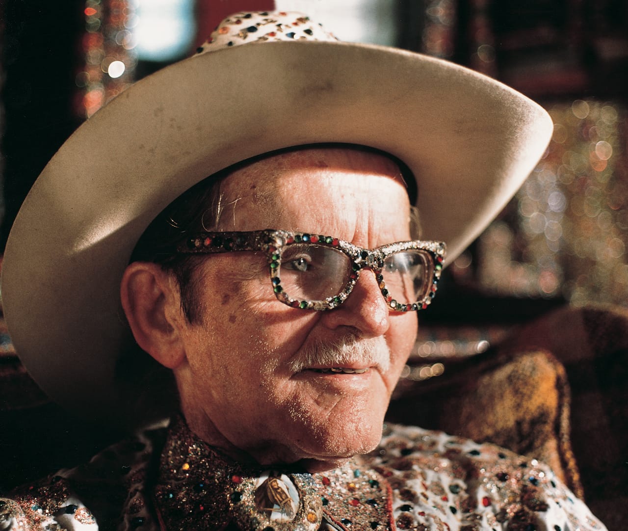 The “Original Rhinestone Cowboy,” Loy Bowlin, in his Beautiful Holy Jewel Home, McComb, Mississippi (1990) (photo by Harrod Blank, courtesy John Michael Kohler Arts Center Artist Archives)