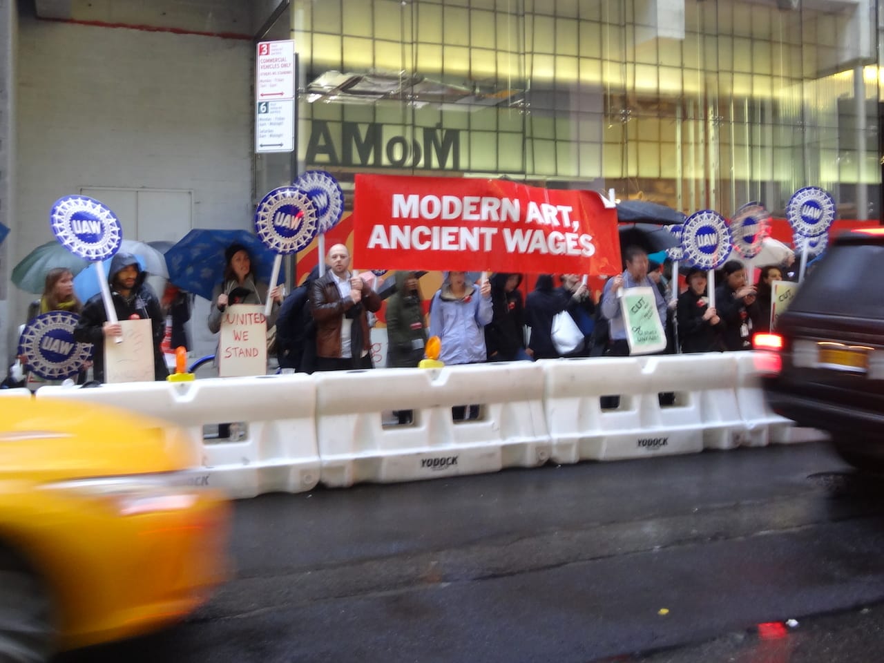 Protesters outside the Museum of Modern Art on 53rd Street on Tuesday night (all photos by the author for Hyperallergic)