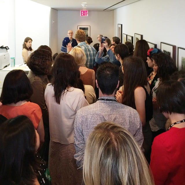 MoMA's Local 2110 members deliver their open letter to museum director Glenn Lowry, who can be seen at top left. (photo by MoMA Local 2110/Instagram)