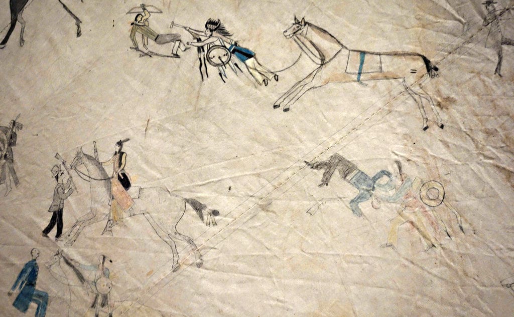 Jṑqī́gácút: Tipi With Battle Pictures