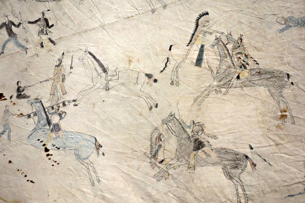 Jṑqī́gácút: Tipi With Battle Pictures