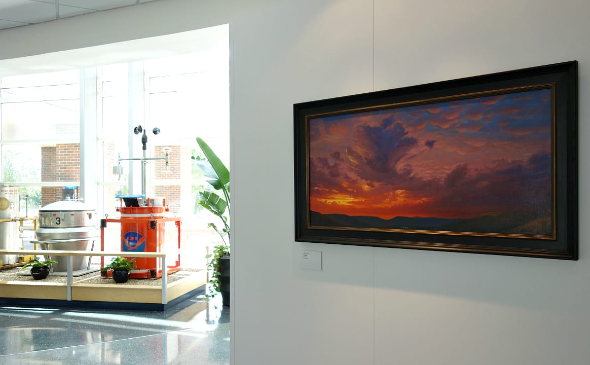 One of NOAA's TOTO portable tornado observatory used in the 1980s at left, and at right is John Hulsey's "Refuge," oil on canvas (photo by the author for Hyperallergic)
