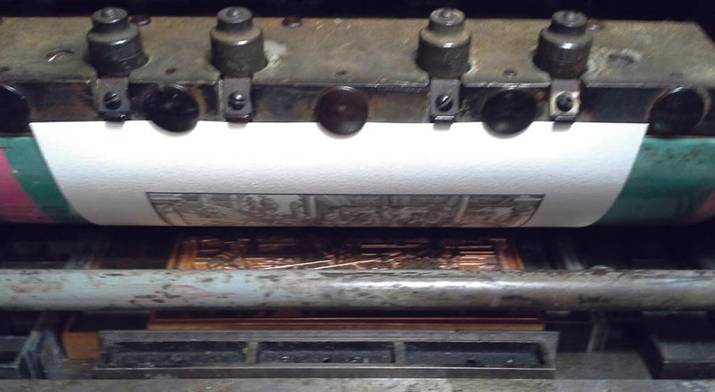 Print being pulled from a Vandercook press