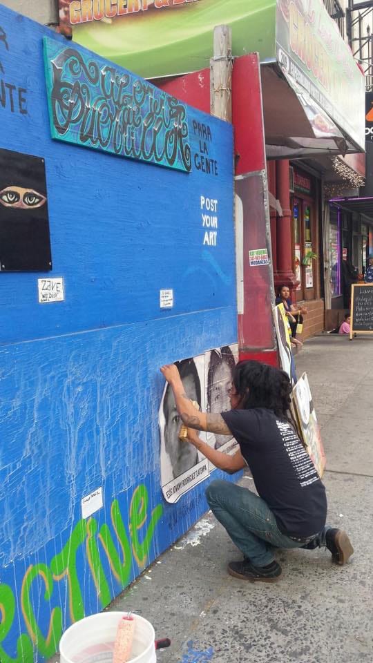 Emilio Zappa putting up his work on the Guerrilla Gallery (click to enlarge)