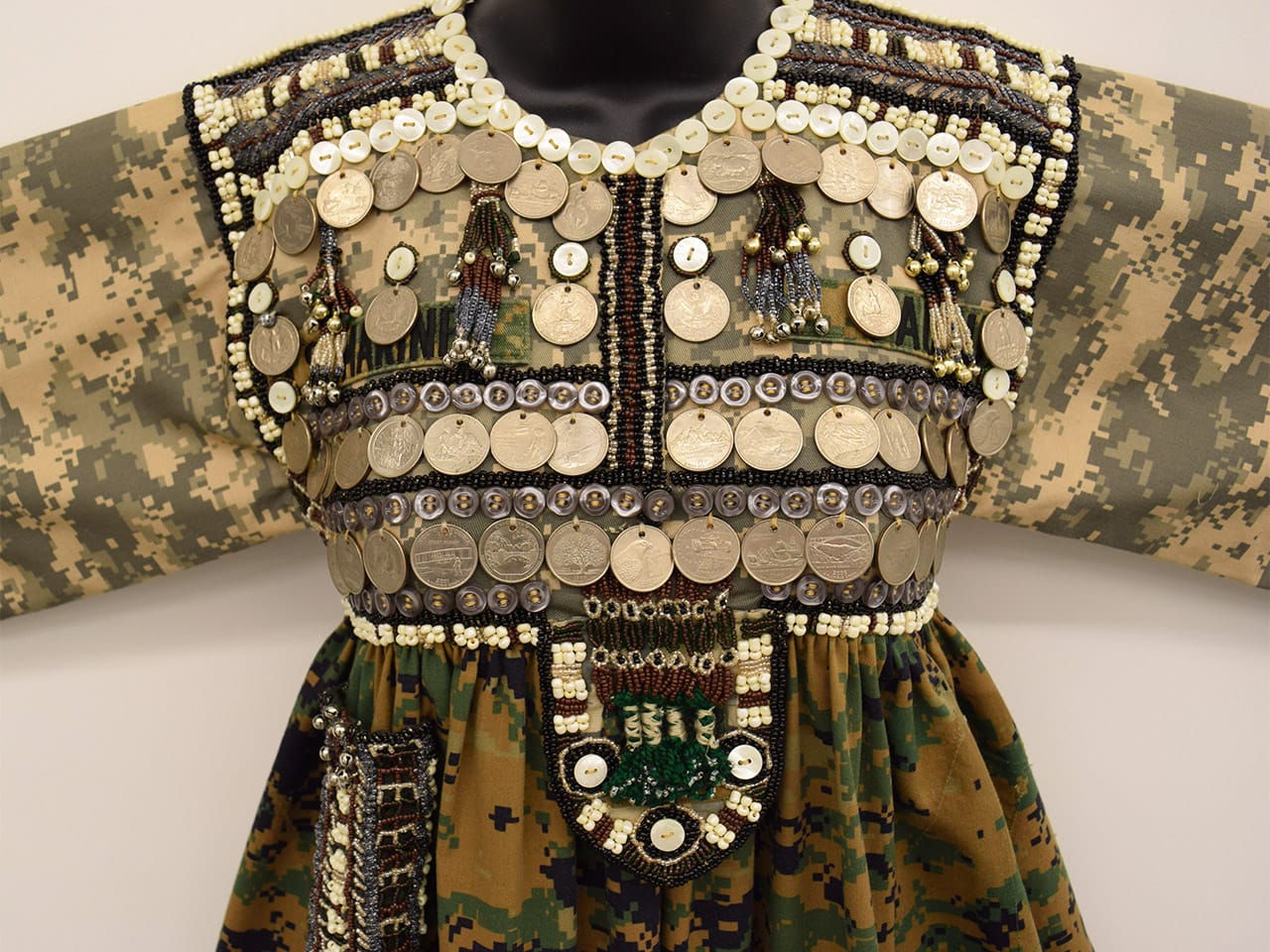 Ignacio Gonzalez-Lang, "Sweeter than Salt" (2014), recycled US Marines and Army uniforms, beads, US coins, glass, silver thread, crochet, lace, metal bells