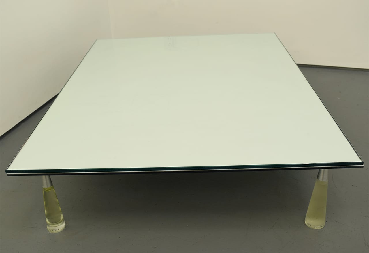 Christopher K. Ho, "Acceptance Letter" (2013), handmade paper, three bottles of l'eau d'Issey, one bottle of l'eau d'Issey concentrée, color print beneath watermarked paper, scent