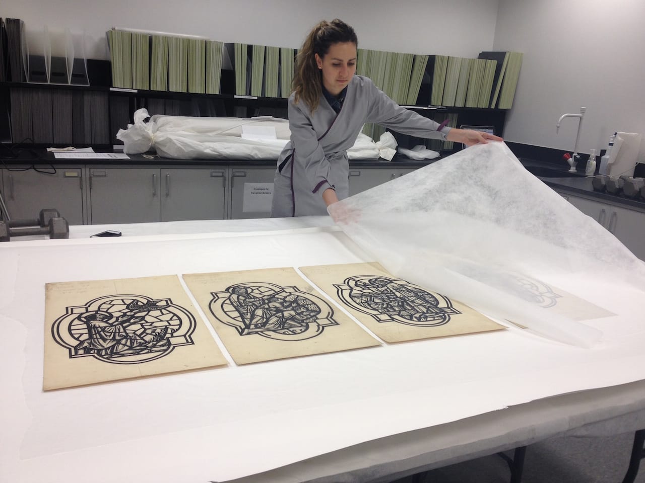 Intern Natasa Krsmanovic places objects on a flattening stack 