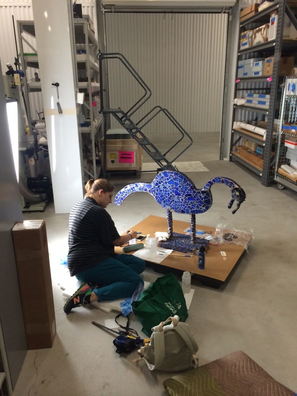 Conservator Linsly Boyer Young with one of Nek Chand's sculptures (courtesy Rubin Museum of Art)