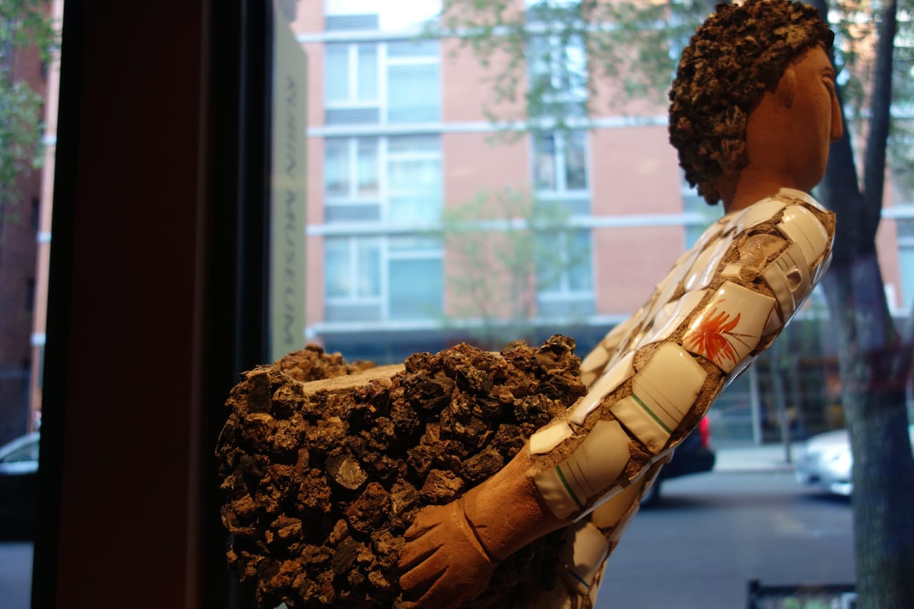 Nek Chand, "Boy with Back Basket, Ceramic Shirt, Clinker Legs" (1984-85), concrete, ceramic