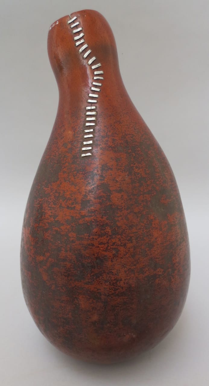 Gourd vessel from Kenya or Tanzania  with a long, vertical, crack in the neck repaired with metal staples (courtesy Pitt Rivers Museum, University of Oxford)