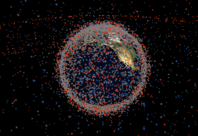 A visualization of satellites and other debris in orbit around Earth on Stuff in Space (GIF by the author for Hyperallergic)