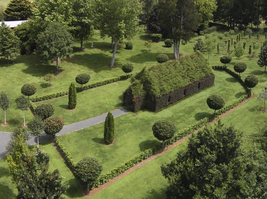 Located in New Zealand, The Tree Church is formed almost entirely from living trees with thick leaves and it can seat a hundred people. (via Colossal)