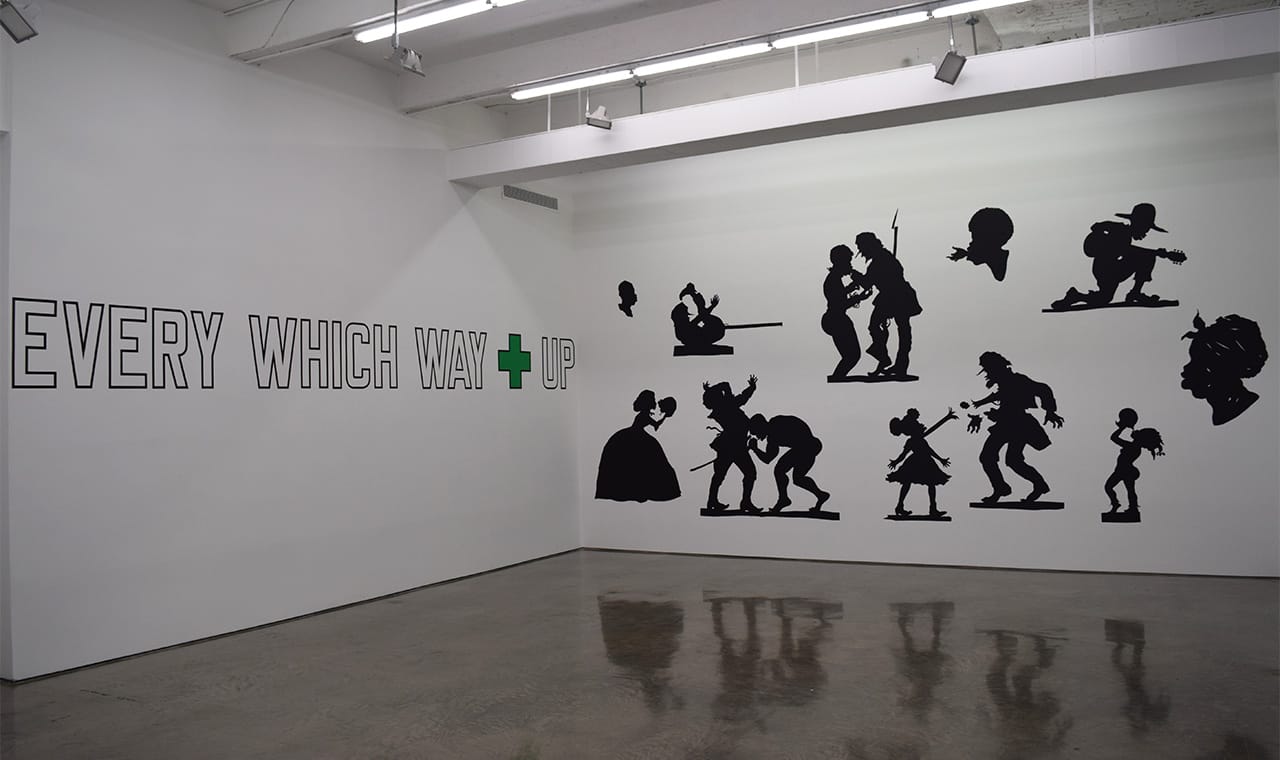 Lawrence Weiner, "LANGUAGE + THE MATERIAL REFERRED TO" (2010, left), Kara Walker, "Auntie Walker's Wall Sampler for Civilians" (2013, right)