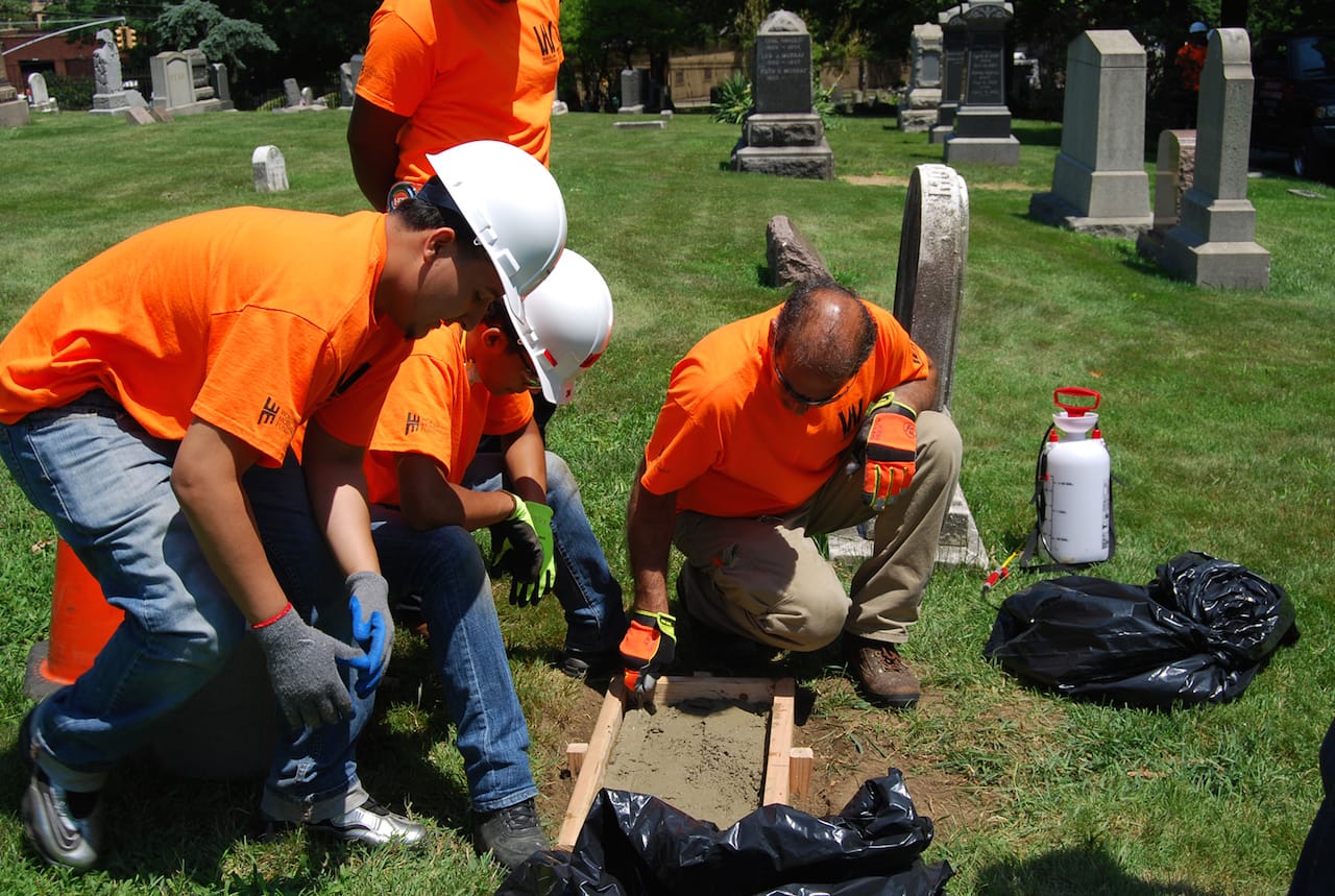 Interns at work in the Woodlawn Cemetery Preservation Training Program (photo by Susan Olsen, courtesy World Monuments Fund)