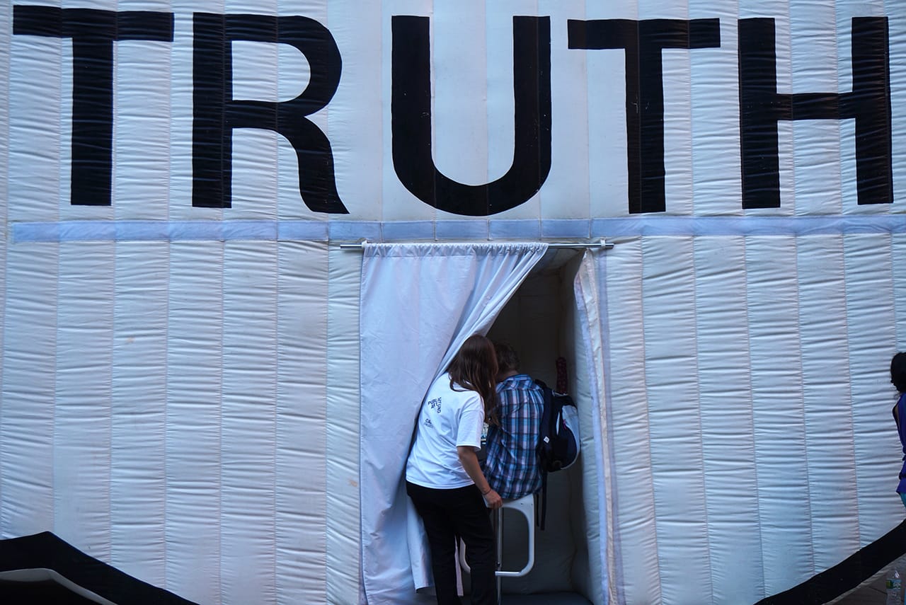 Someone entering "The Truth Booth"