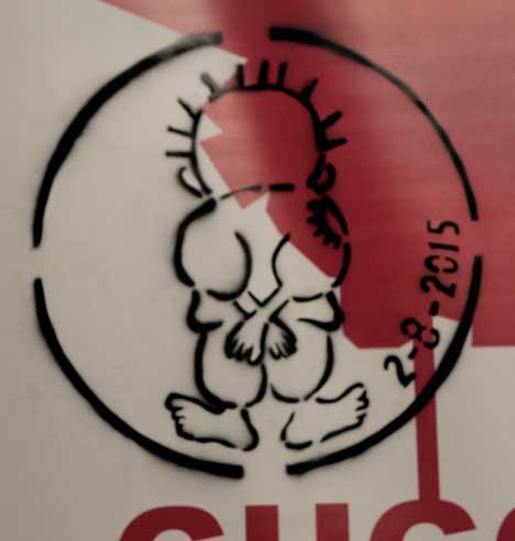 The stenciled image of Handala on the Gulf Labor banner in the Arsenale.