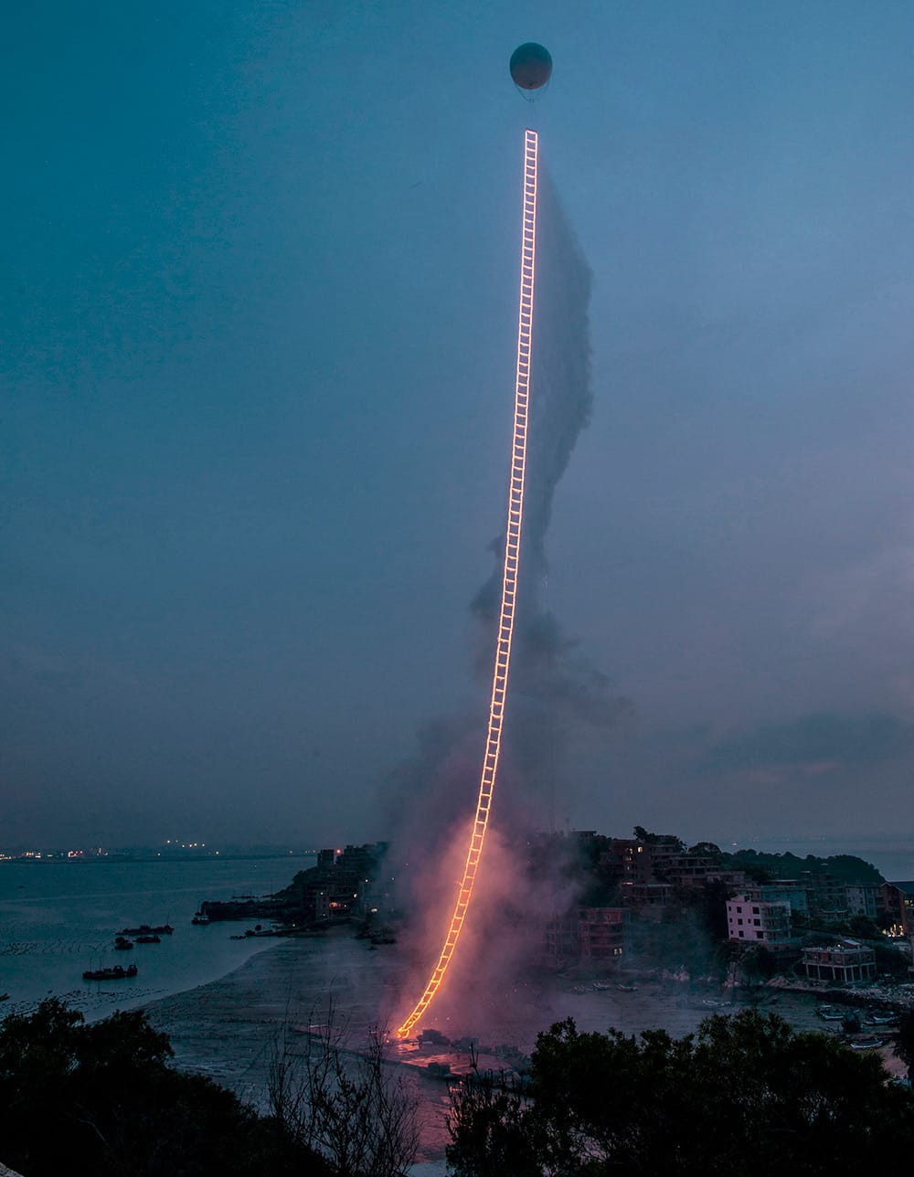 Sky Ladder, realized at Huiyu Island Harbour, Quanzhou, Fujian, June 15, 2015 at 4:49 am, approximately 2 minutes and 30 seconds. Photos by Lin Yi & Wen-You Cai, courtesy Cai Studio. (via Colossal)
