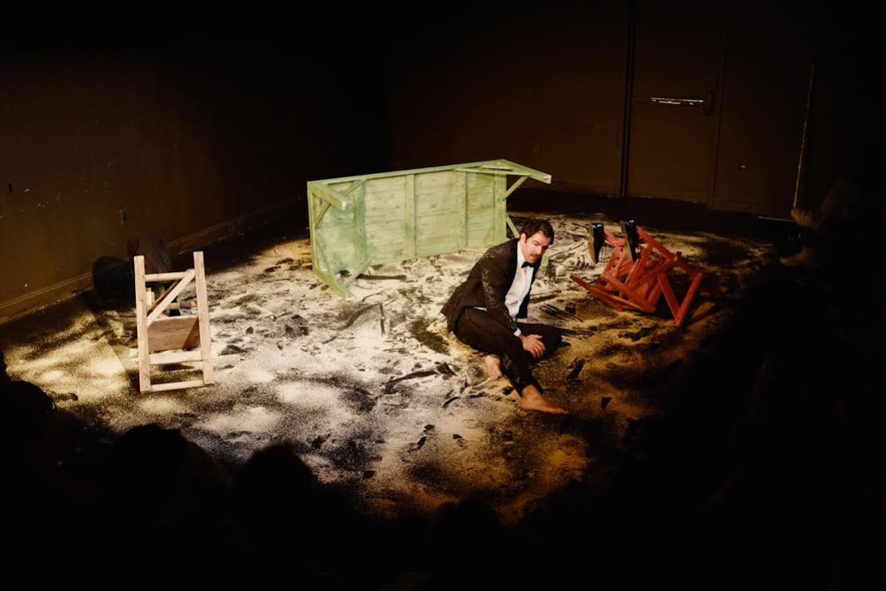 Christopher Domig recites T.S Eliot's Wasteland amidst sawdust in 'The Wasteland' (2015) (photo by Thomas Weitzman, courtesy of the Wasteland Project)