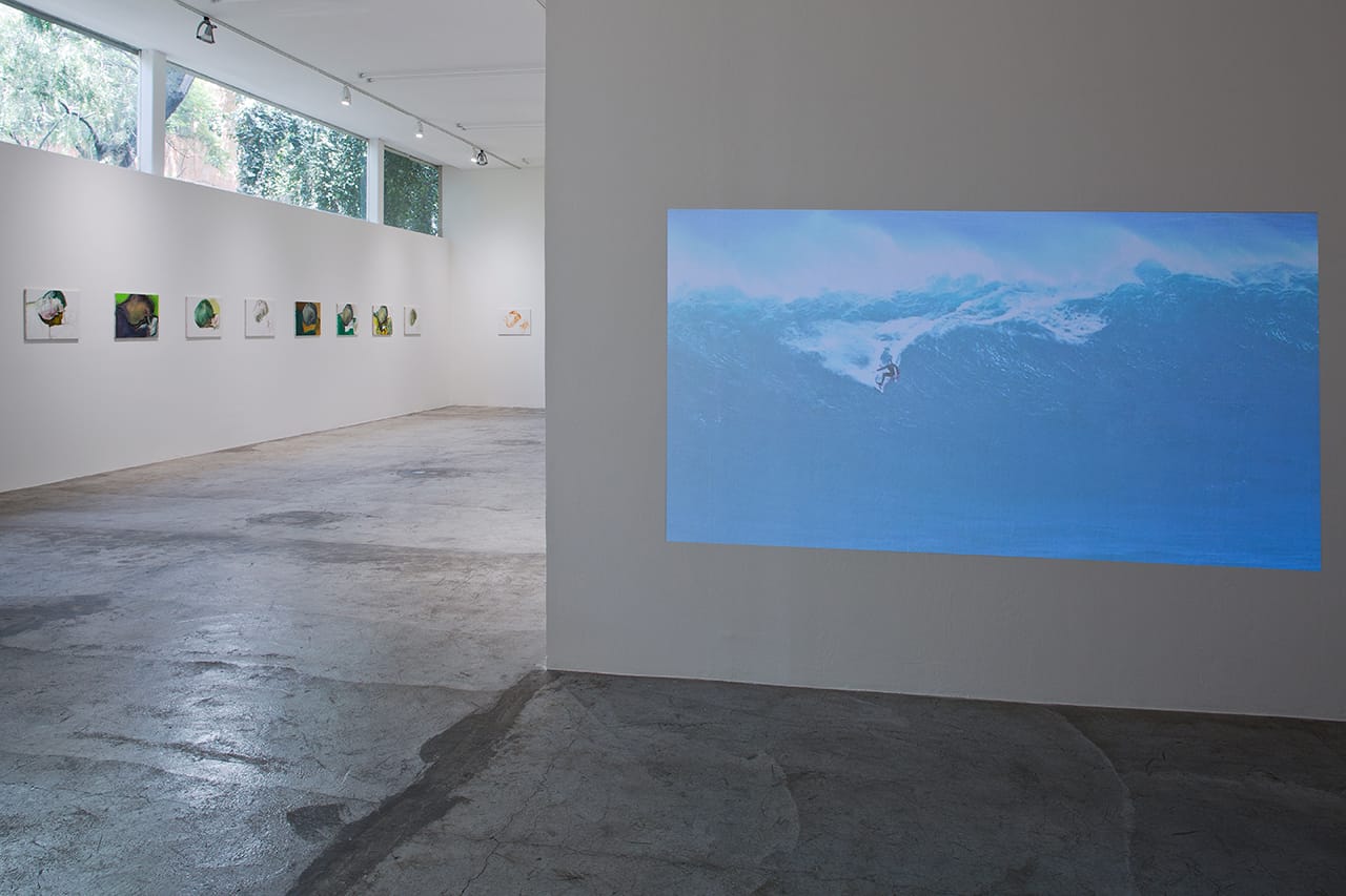 Left, Hans Witschi, "Ohne Titel (Zeichnender) | Untitled (Boy Drawing)" (1998), and right, Nicolas Provost, "The Perfect Wave" (2014) in 'Til I Get It Right' at LABOR gallery (photo by Ramiro Chaves, image courtesy the artists and LABOR, México City)