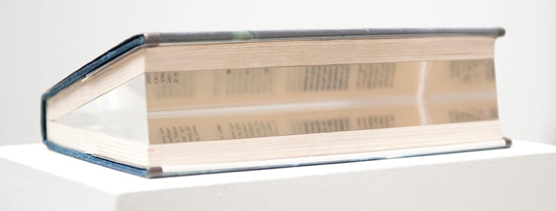 Jacob Kassay, "Untitled" (2015), Glass, borrowed library book. (via vsf.la)