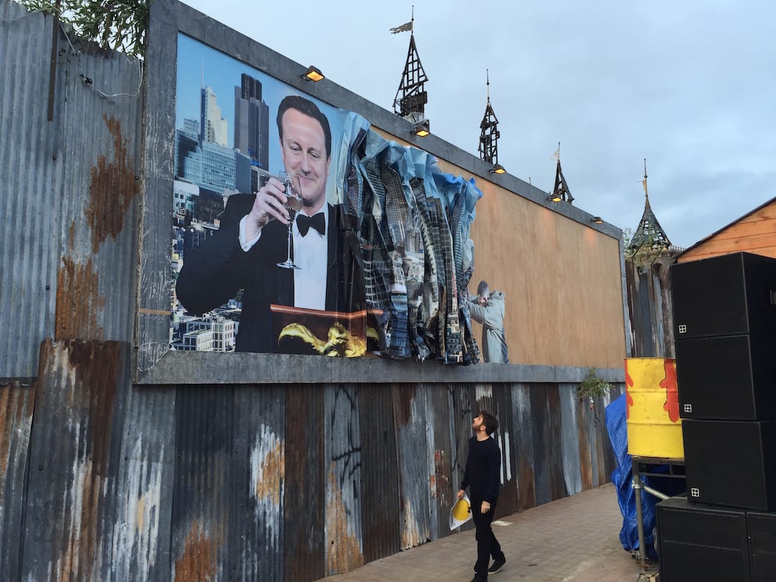 Billboard by Peter Kennard & Cat Phillips. (click to enlarge)