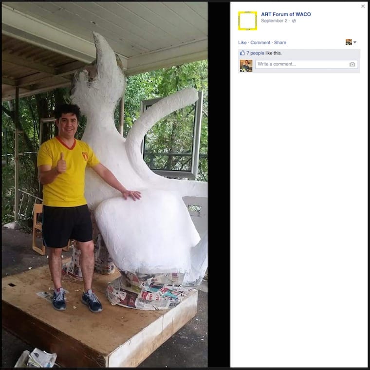 Artist Jesus Rivera with his cat sculpture before it was destroyed. (screenshot by the author, via Facebook)