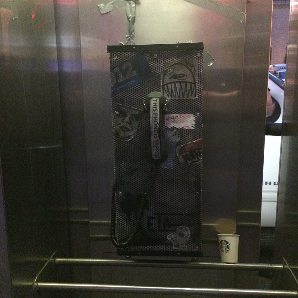 Waiting for the phone to ring at the beginning of Empire Travel Agency (photo by the author for Hyperallergic)