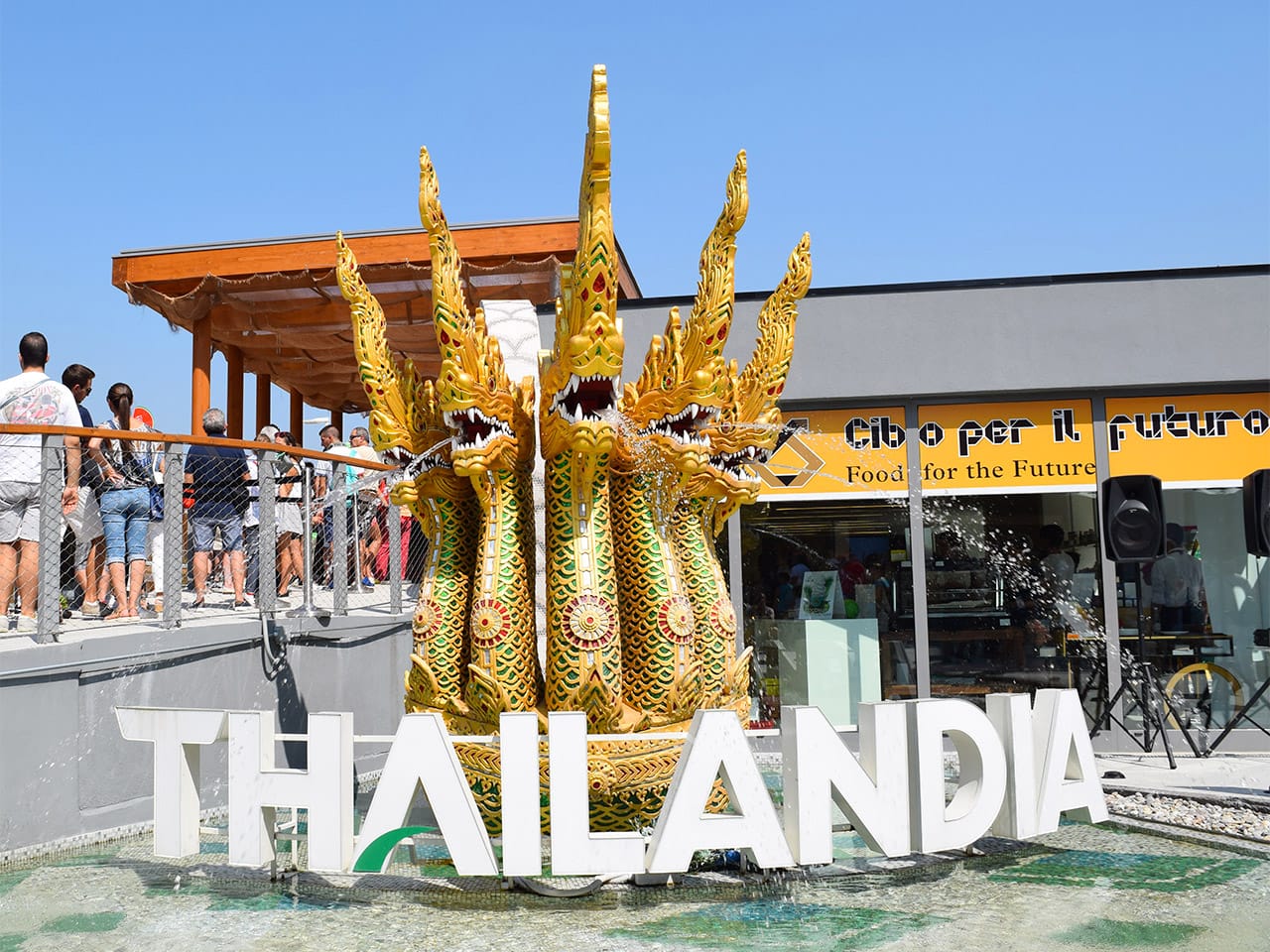 A sculpture of the "King of Naga" serpent at the entrance to the Thai pavilion