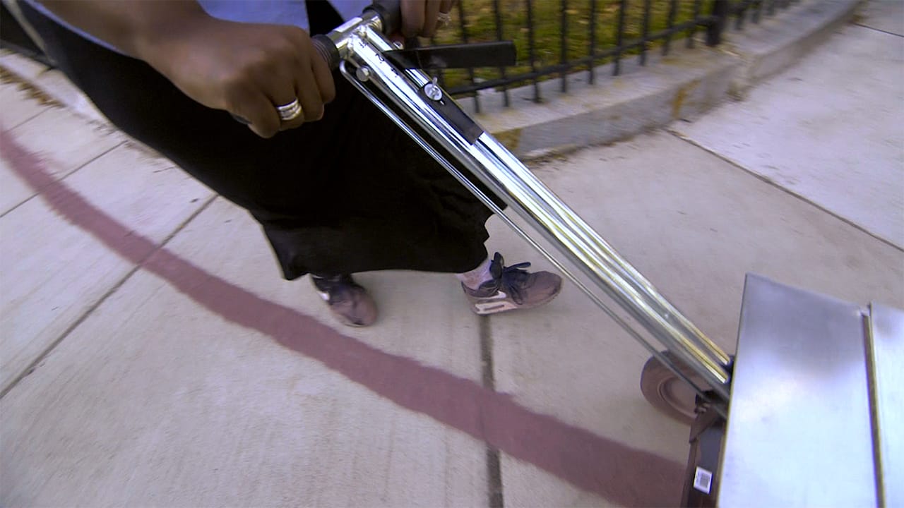 Carolyn Lomax pushing the lining tool along the route