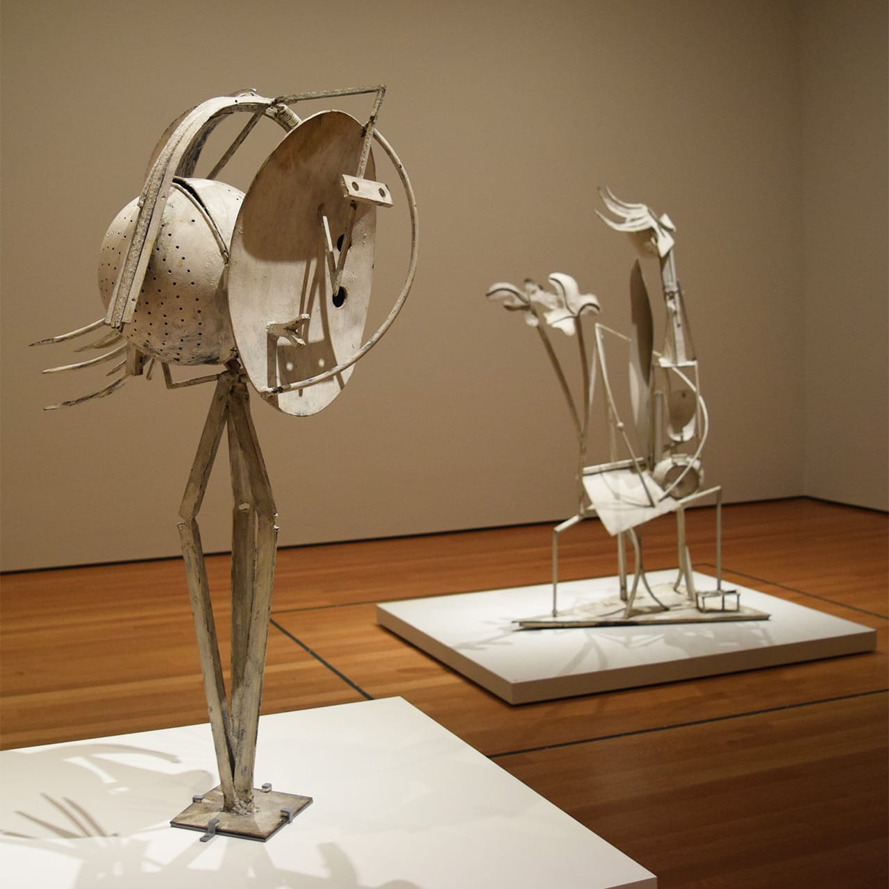 Installation view of 'Picasso Sculpture' at the Museum of Modern Art with Pablo Picasso's "Head of a Woman" (1929–30) at left and "Woman in the Garden" (1929–30) at right