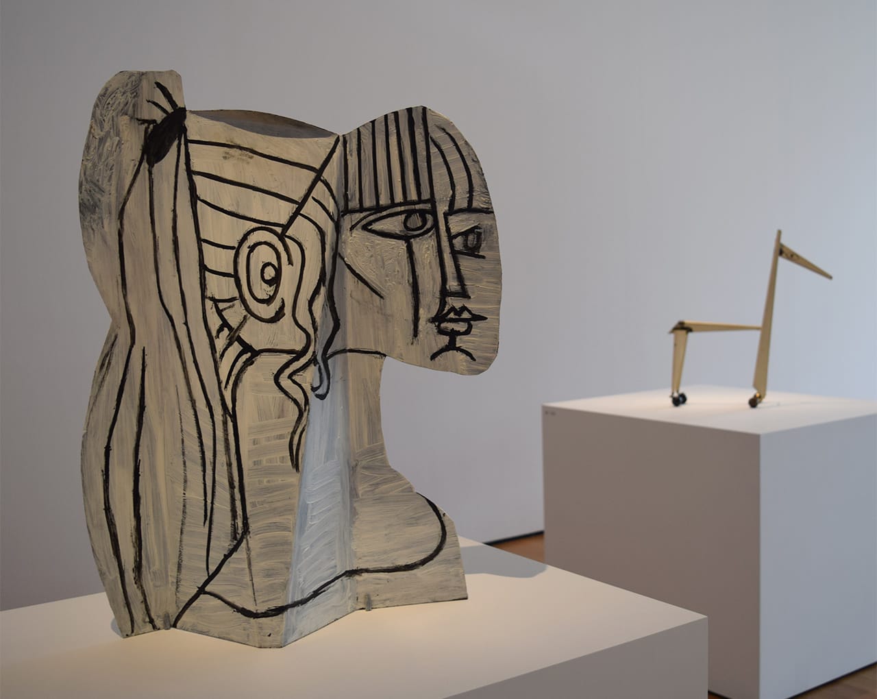 Installation view of 'Picasso Sculpture' at the Museum of Modern Art with Pablo Picasso's "Sylvette" (1954) at left and "Little Horse" (1961) at right (all photos by the author for Hyperallergic)