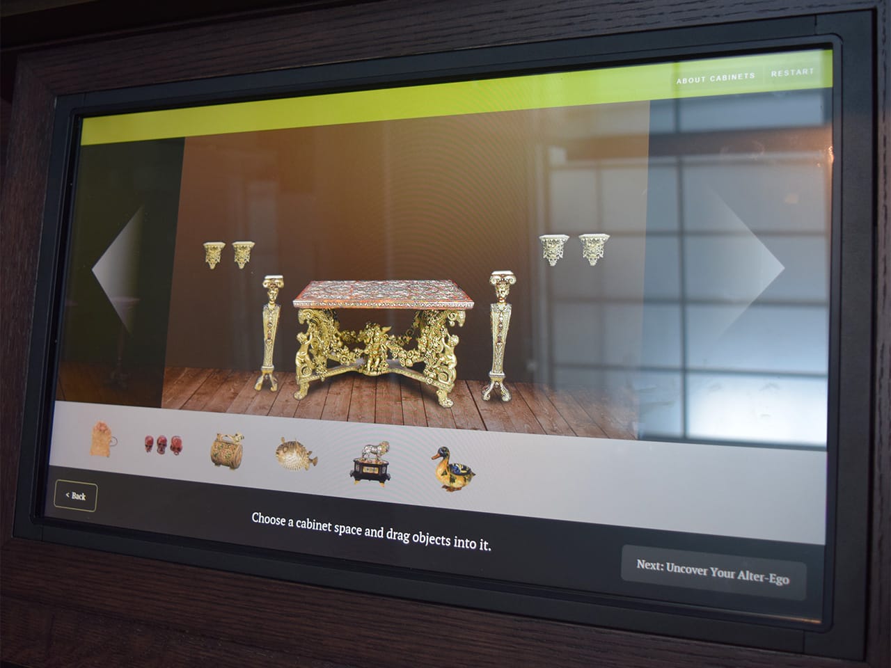 An interactive, build-your-own-cabinet of curiosities touch-screen in the Wadsworth Atheneum's Cabinet of Art and Curiosities gallery