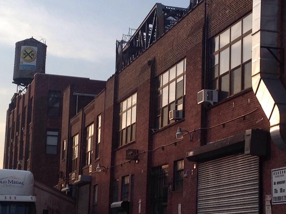 A view of the buildings on 10th Street, with Maserati Realty's logo on the water tower in the background (photo by Mahalia Stines)