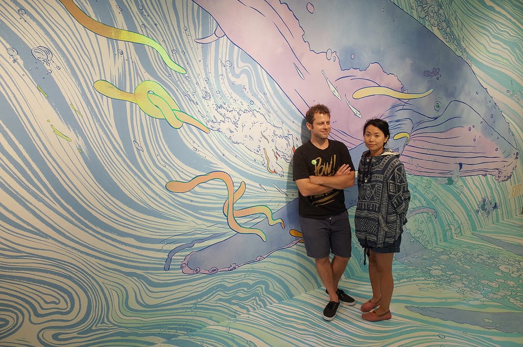 Kozue and Dan Kitchens (of Kozyndan) in front of mural at the Japanese American National Museum (photo courtesy of Giant Robot)