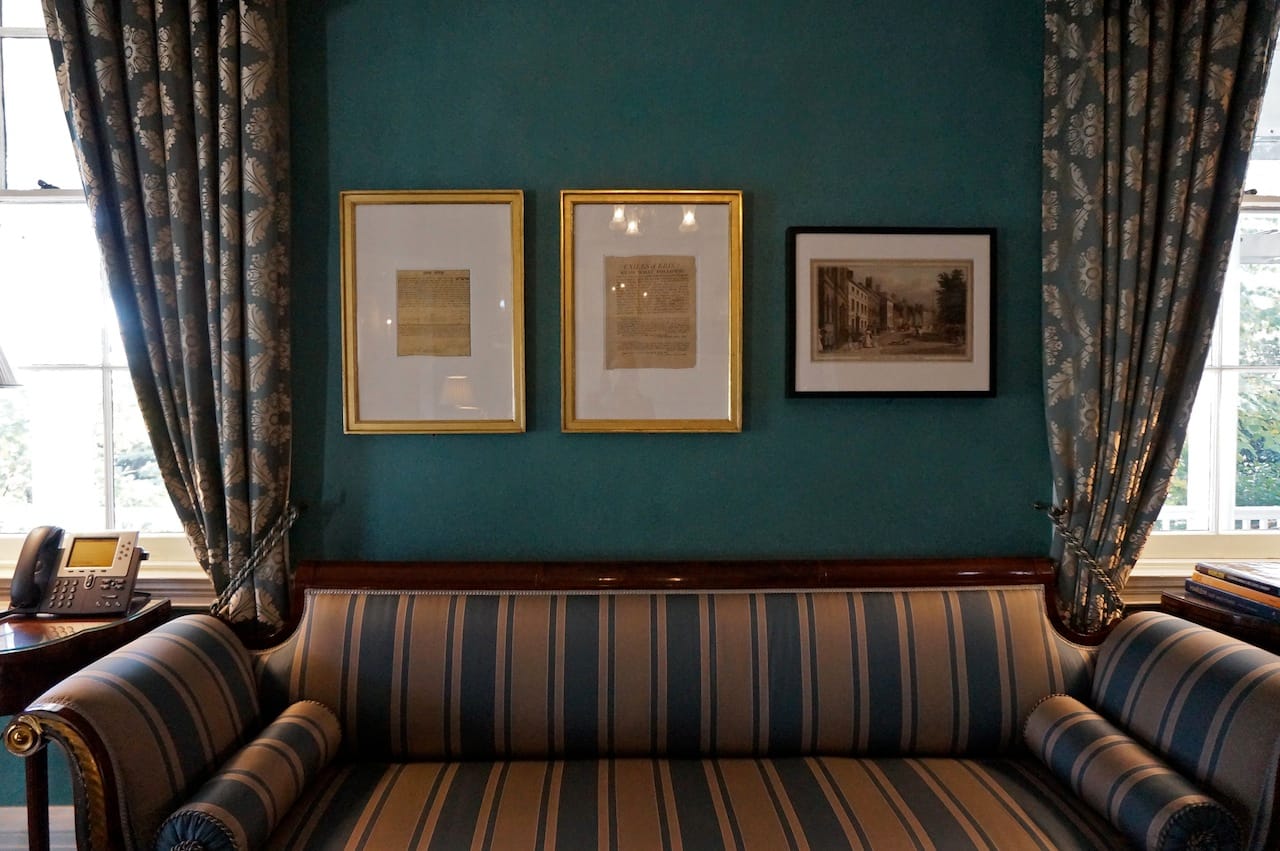 A row of pieces in the Gracie Mansion library, with "EXILES of ERIN!" in the middle