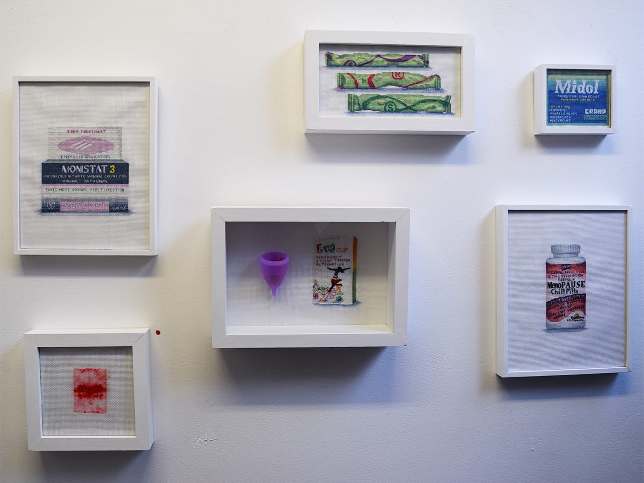 Cross stitch renderings of women's birth control and sexual health products by Katrina Majkut at Brooklyn Art Space (400 3rd Avenue)