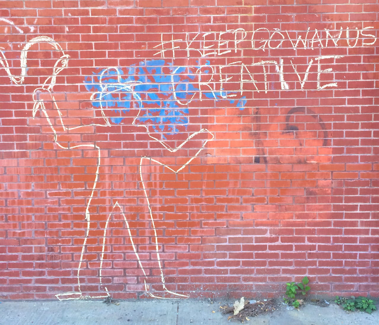 A chalk mural on the exterior of one of the buildings on 9th Street from which artists are being evicted