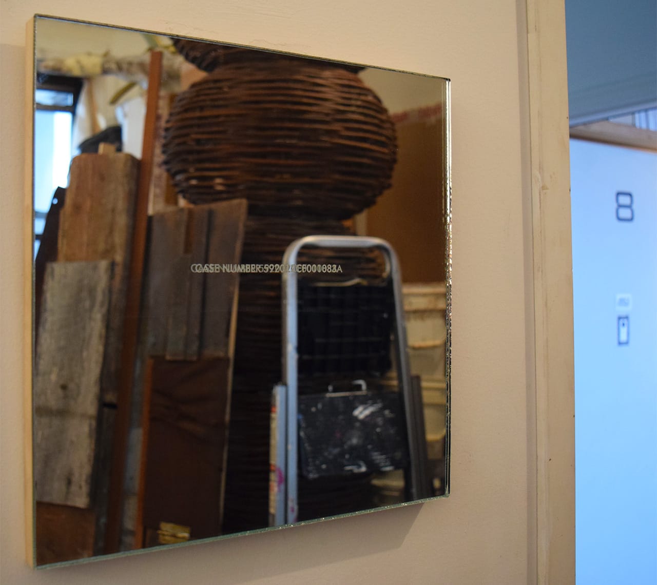 A mirror sculpture etched with the case number for Trayvon Martin's murder, by Kimberly Mayhorn, in her studio at 183 Lorraine Street